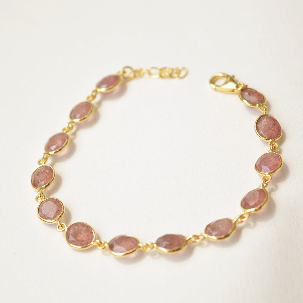Adjustable silver bracelet with faceted pink gemstone and lobster clasp