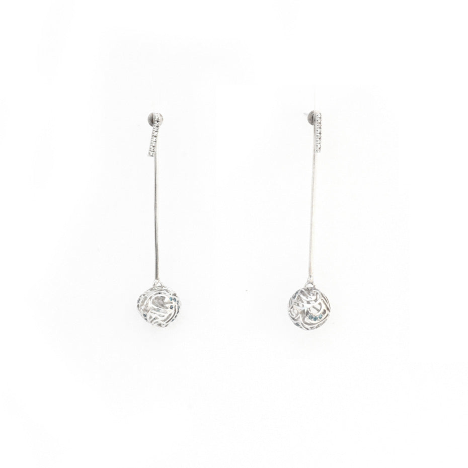 Handcrafted platinum-plated brass drop earrings featuring a tiered wave design with intricate silver jali lattice work and vibrant turquoise blue gemstones.