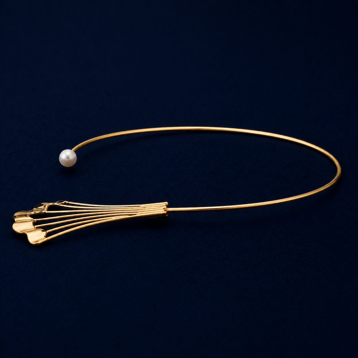 A side perspective of the Soft Glow choker highlighting the sleek, flexible neck cuff design and the polished finish of the modern fan-shaped charm on a dark navy background.