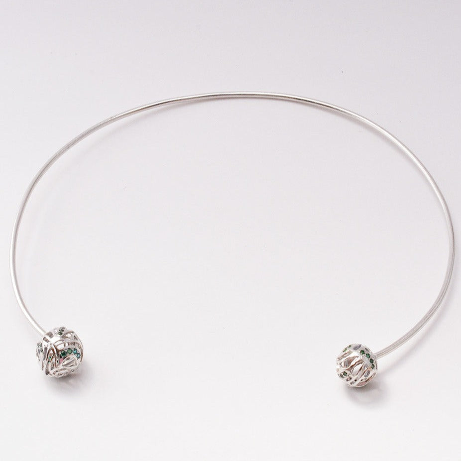 A contemporary brass choker featuring a bold, sculptural, wave-inspired design with a high-shine, polished finish, isolated on a white background.
