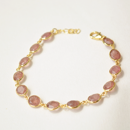 Adjustable silver bracelet with faceted pink gemstone and lobster clasp
