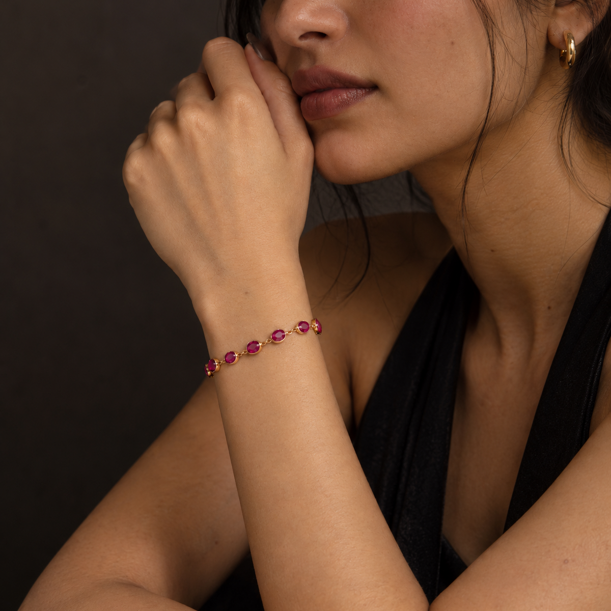 925 sterling silver pink jade gemstone bracelet with faceted natural pink jade stones worn on a woman's wrist