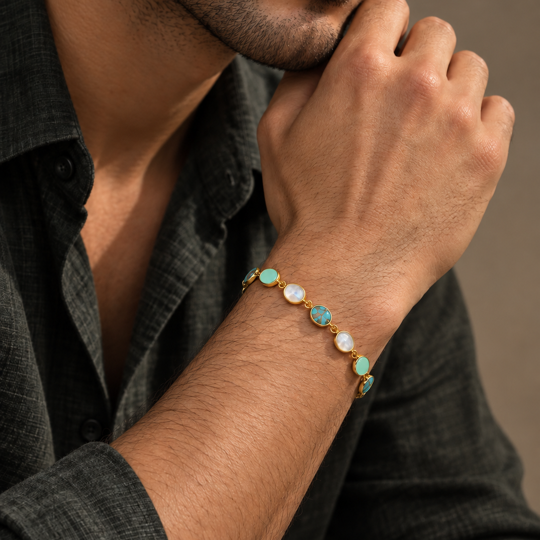 Shades of Blue Bracelet in 925 sterling silver with natural turquoise, rainbow moonstone and aquamarine stones worn on a man's wrist.