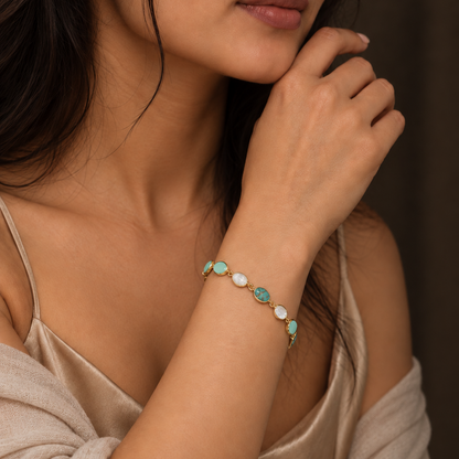 925 sterling silver Shades of Blue Bracelet with natural copper turquoise, rainbow moonstone and aquamarine gemstones worn on a woman's wrist.