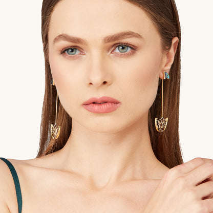 Front-facing view of the Ethereal Shoulder Duster earrings on a model, showcasing the symmetrical statement look of the long drop jewelry.