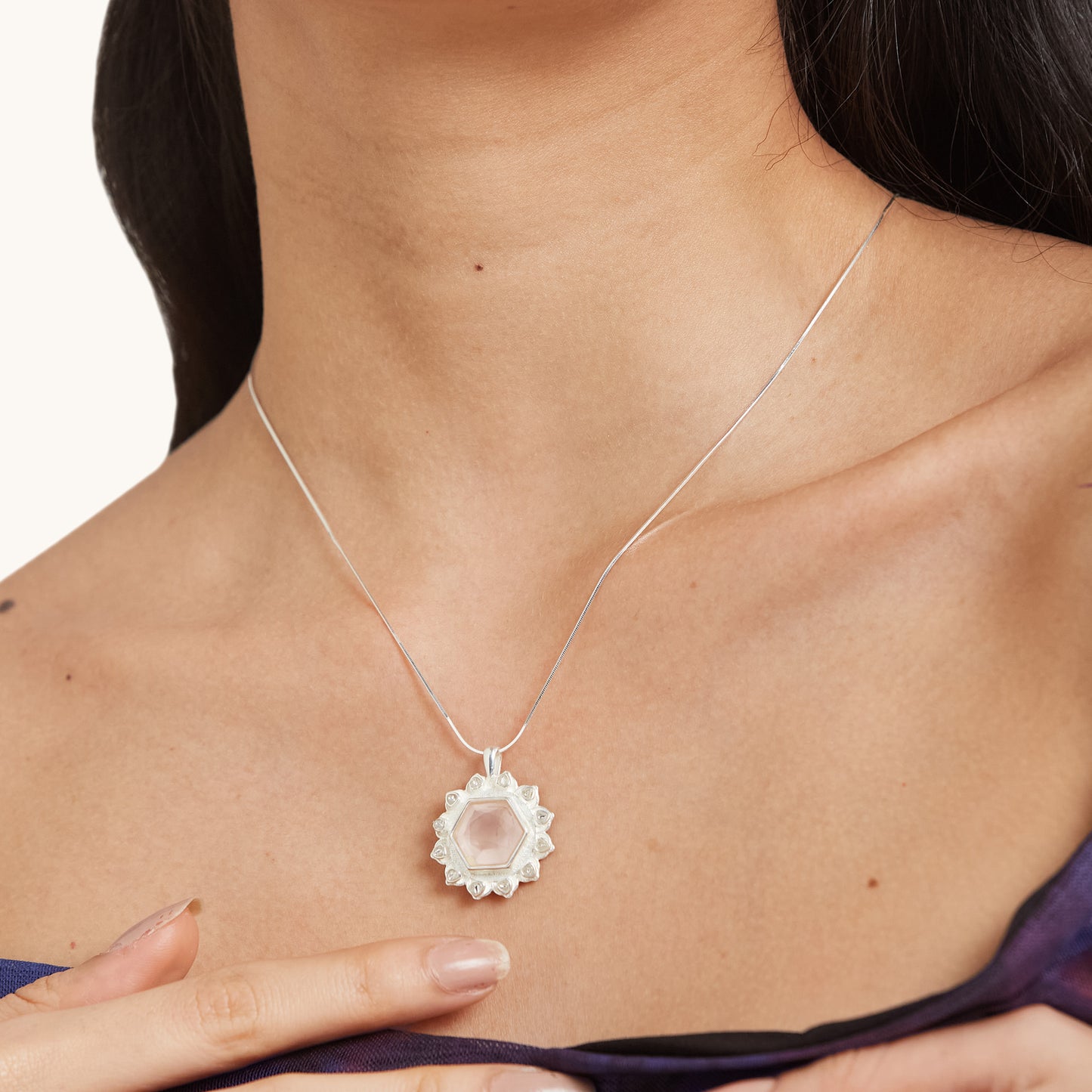 Close-up of a person wearing a delicate, emphasizing its versatile and sophisticated appeal for both formal and casual looks.