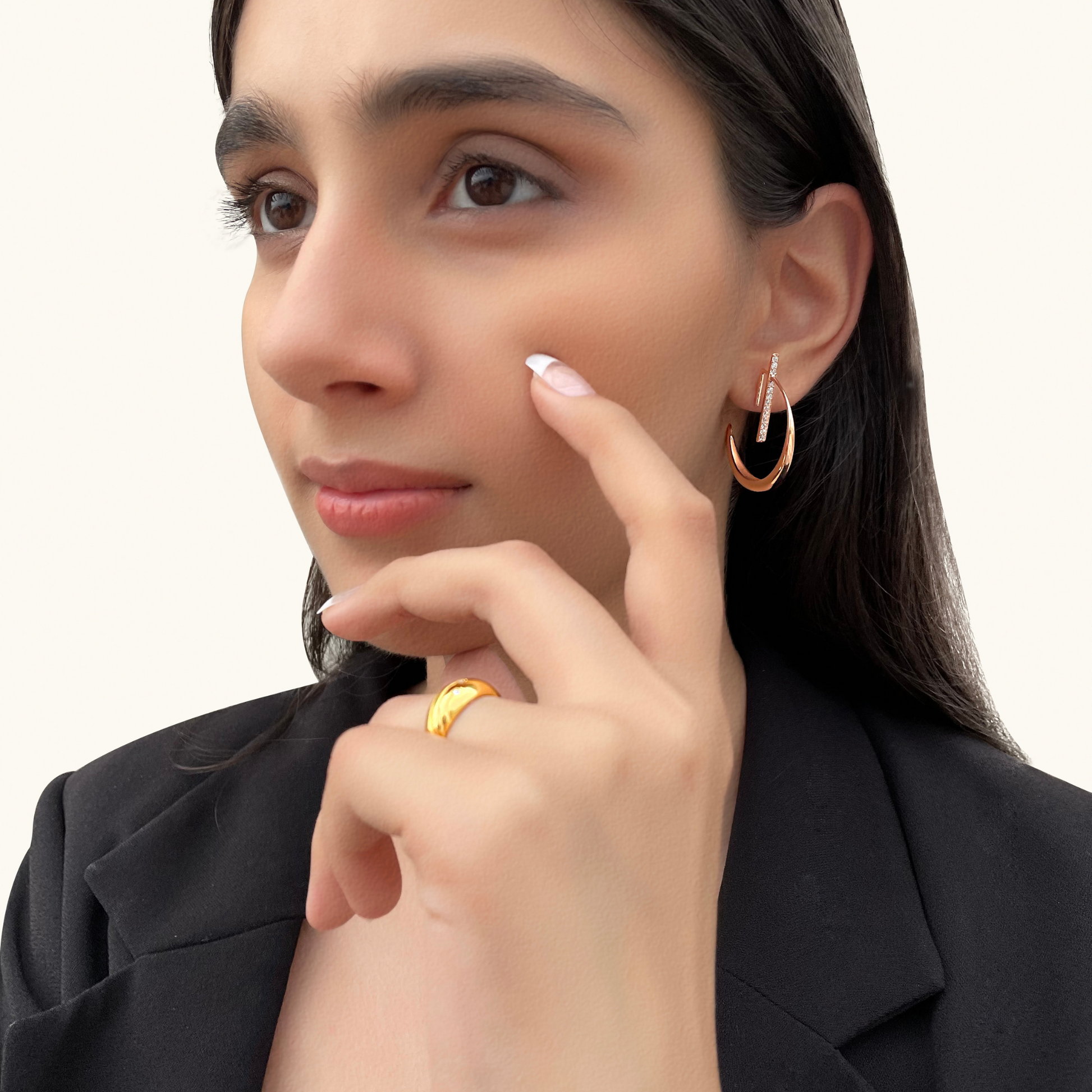 Model wearing La Luna Rose Gold Earrings paired with a black blazer for a sophisticated, modern celestial look.