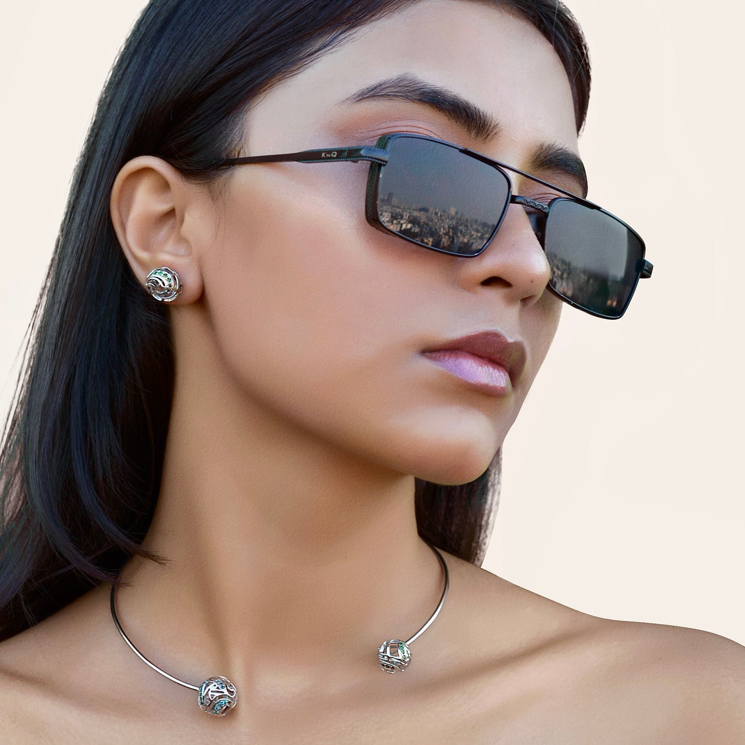 A close-up view of a person wearing a statement brass choker that sits comfortably at the base of the neck, highlighting its high-luster finish.