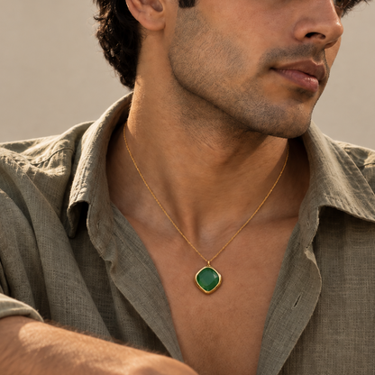 Emerald Glow Pendant with an organic square green onyx gemstone and gold-plated chain, styled on a male model.