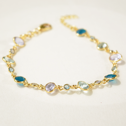 Elegant silver link bracelet showcasing a mix of polished semi-precious stones, highlighting its refined, colorful design.