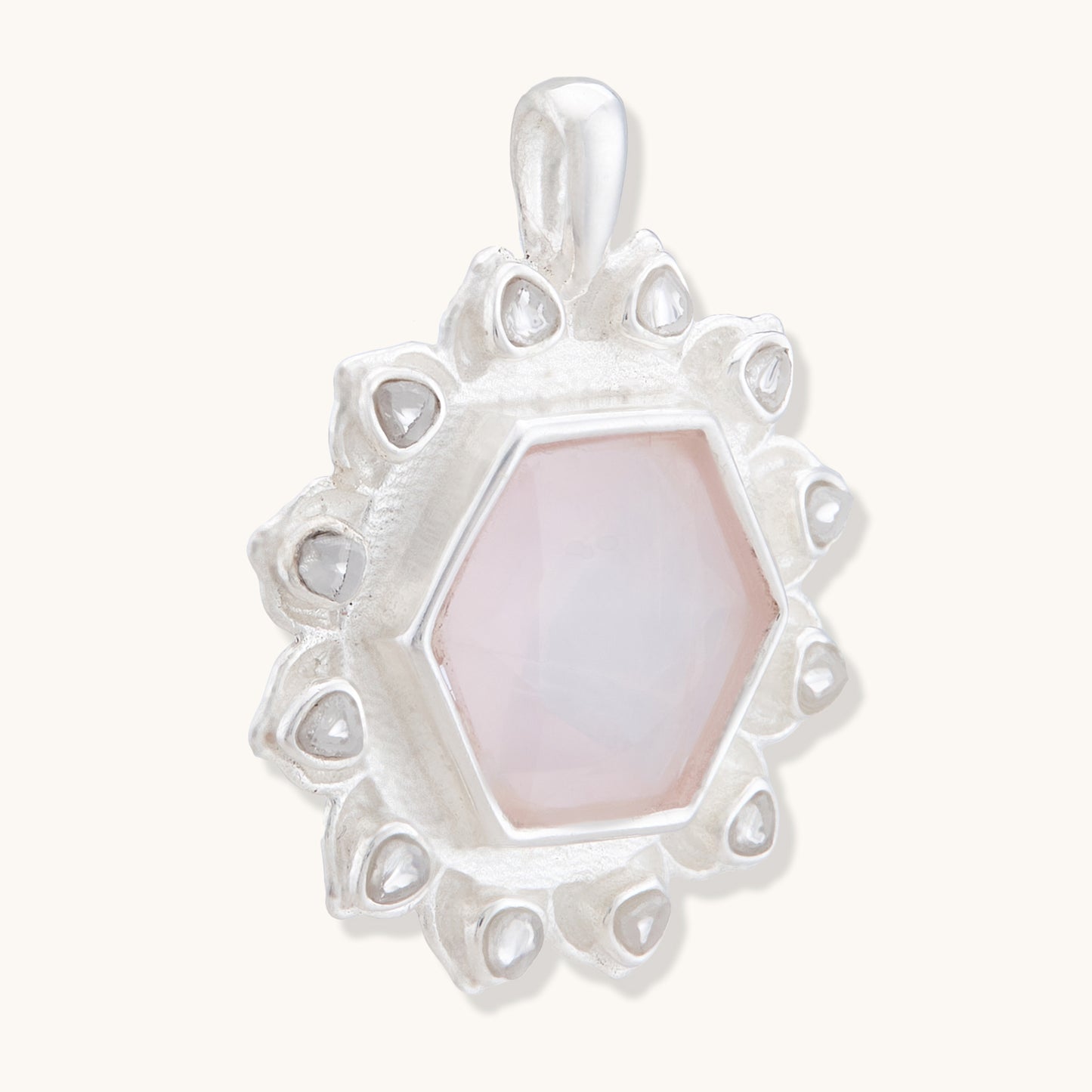 Close-up of a warm-toned, faceted gemstone pendant, highlighting its elegant and minimalist craftsmanship.