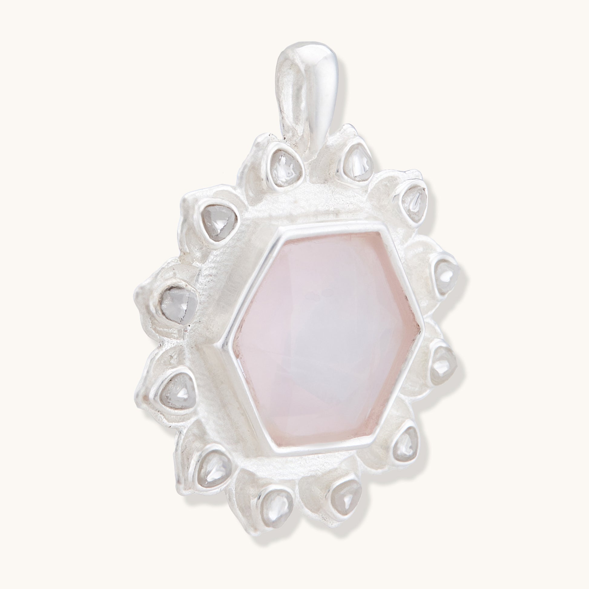 Close-up of a warm-toned, faceted gemstone pendant, highlighting its elegant and minimalist craftsmanship.