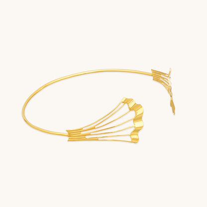 Side view of the Gold Flow Necklet showing the delicate gold wire frame and sculpted, ridged metal accents.