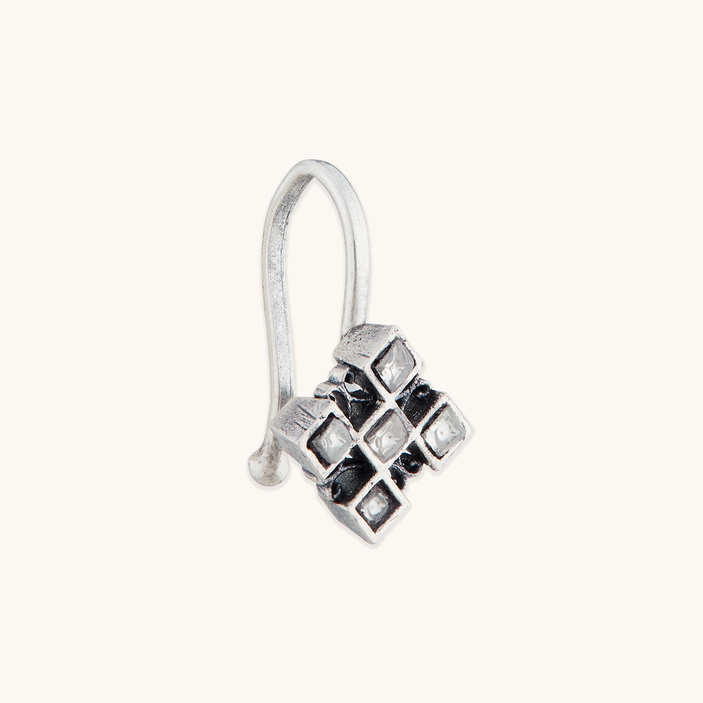 An angled view of a silver-toned, non-piercing nose ring showcasing a geometric, multi-square metal design with inset reflective stones.
