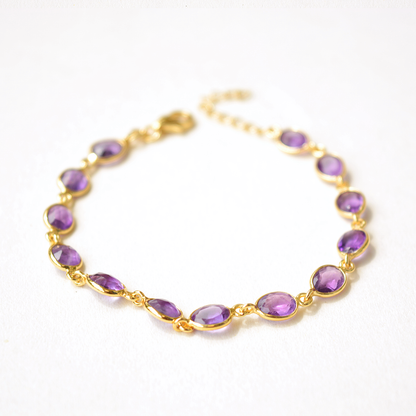 Elegant silver link bracelet showcasing a smooth, round purple stone set in a minimalist bezel.