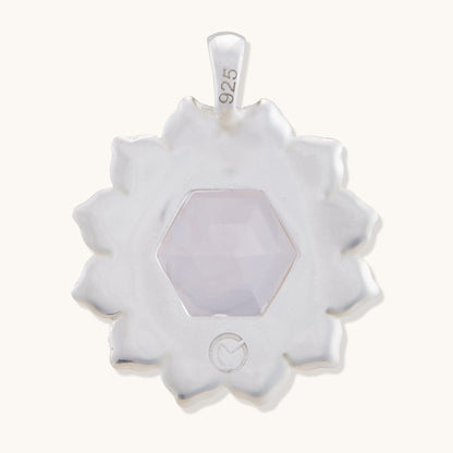 Back view of a refined gemstone pendant isolated on a white background, showcasing a polished finish and timeless, feminine design.