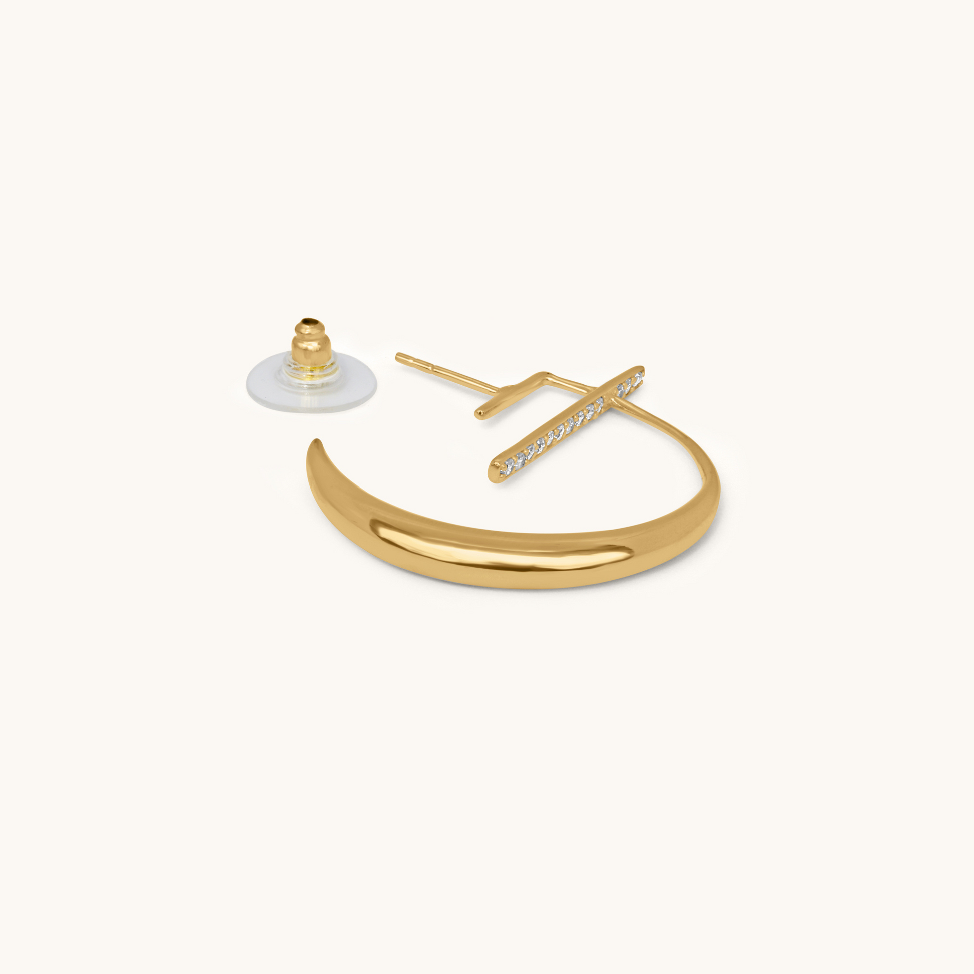 Deconstructed view of the La Luna Earring in yellow gold, showing the individual components: the crescent moon ear jacket, the diamond vertical stud, and the earring back.