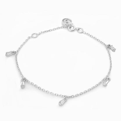 A fine silver chain bracelet adorned with five sparkling, baguette-shaped stone charms, presented on a plain white background.