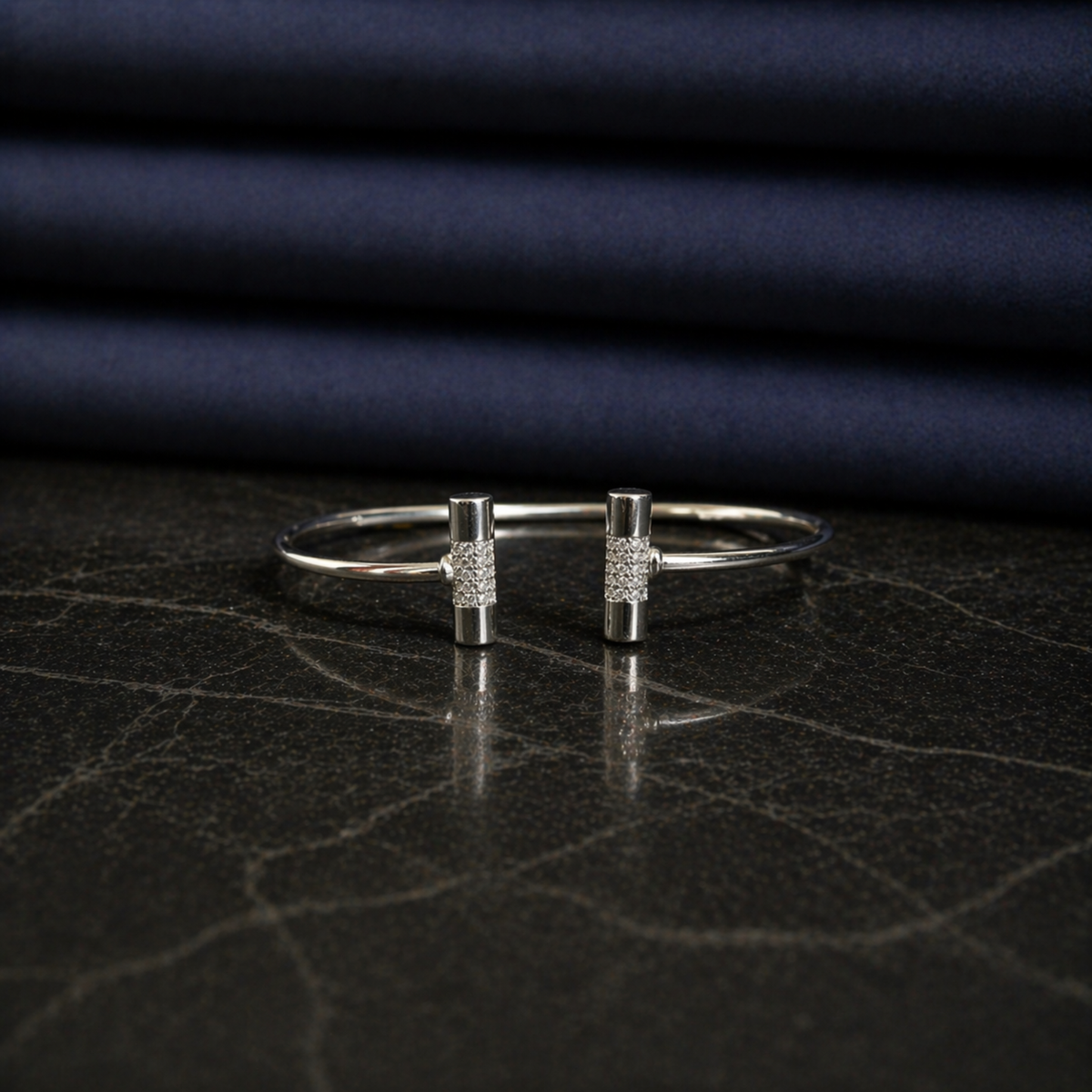 Front view of the handcrafted Sparkle_Line_Bangle in rhodium-plated 925 sterling silver featuring CZ-encrusted cylindrical bars.