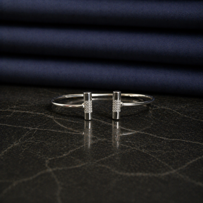 Front view of the handcrafted Sparkle_Line_Bangle in rhodium-plated 925 sterling silver featuring CZ-encrusted cylindrical bars.