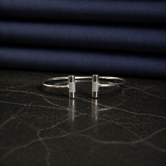 Front view of the handcrafted Sparkle_Line_Bangle in rhodium-plated 925 sterling silver featuring CZ-encrusted cylindrical bars.