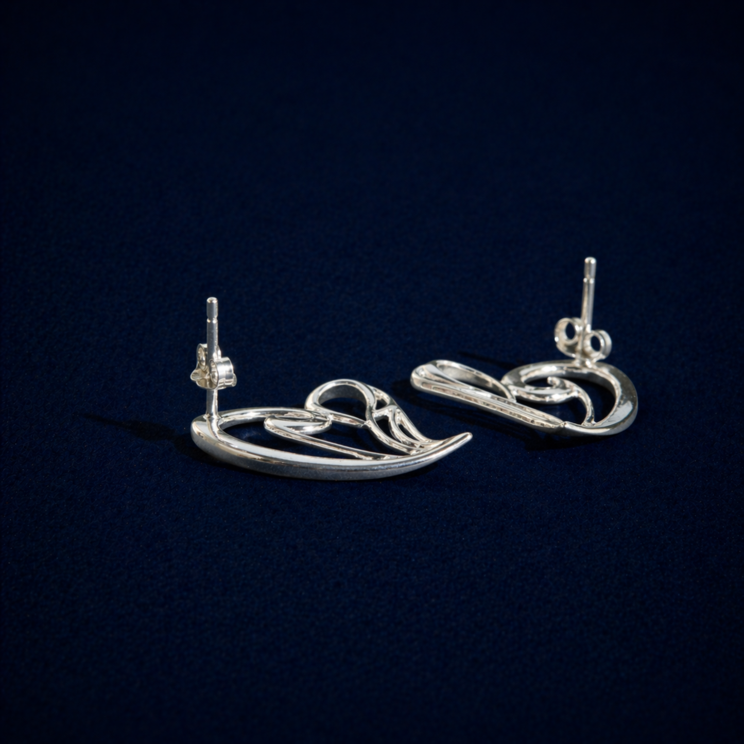 Rear angle of the handcrafted Trueform Heart earrings highlighting the secure pushback stud closure and polished silver finish.
