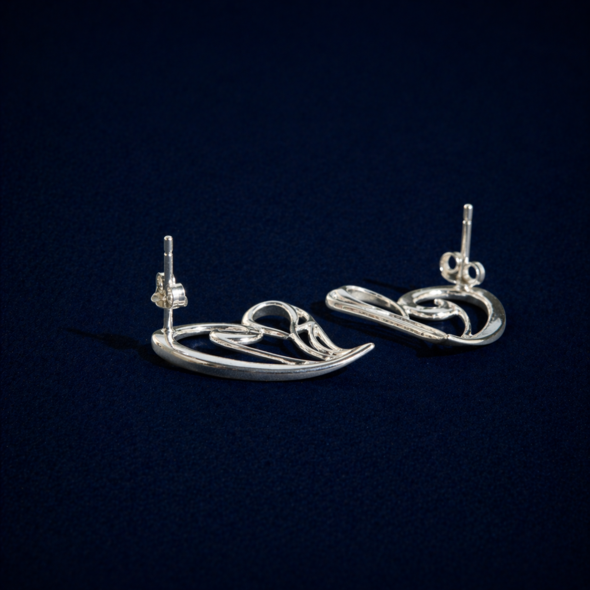 Rear angle of the handcrafted Trueform Heart earrings highlighting the secure pushback stud closure and polished silver finish.