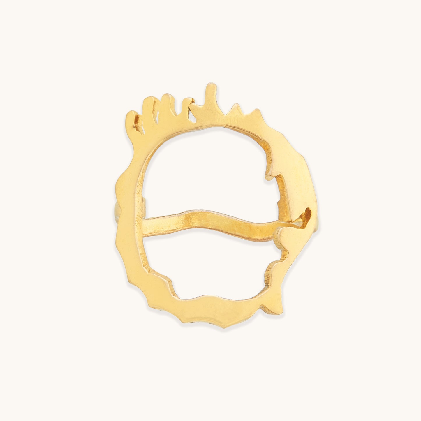 Front view of an irregular gold-tone ring featuring a unique, hand-crafted aesthetic with a series of vertical "drip" accents along the rim.