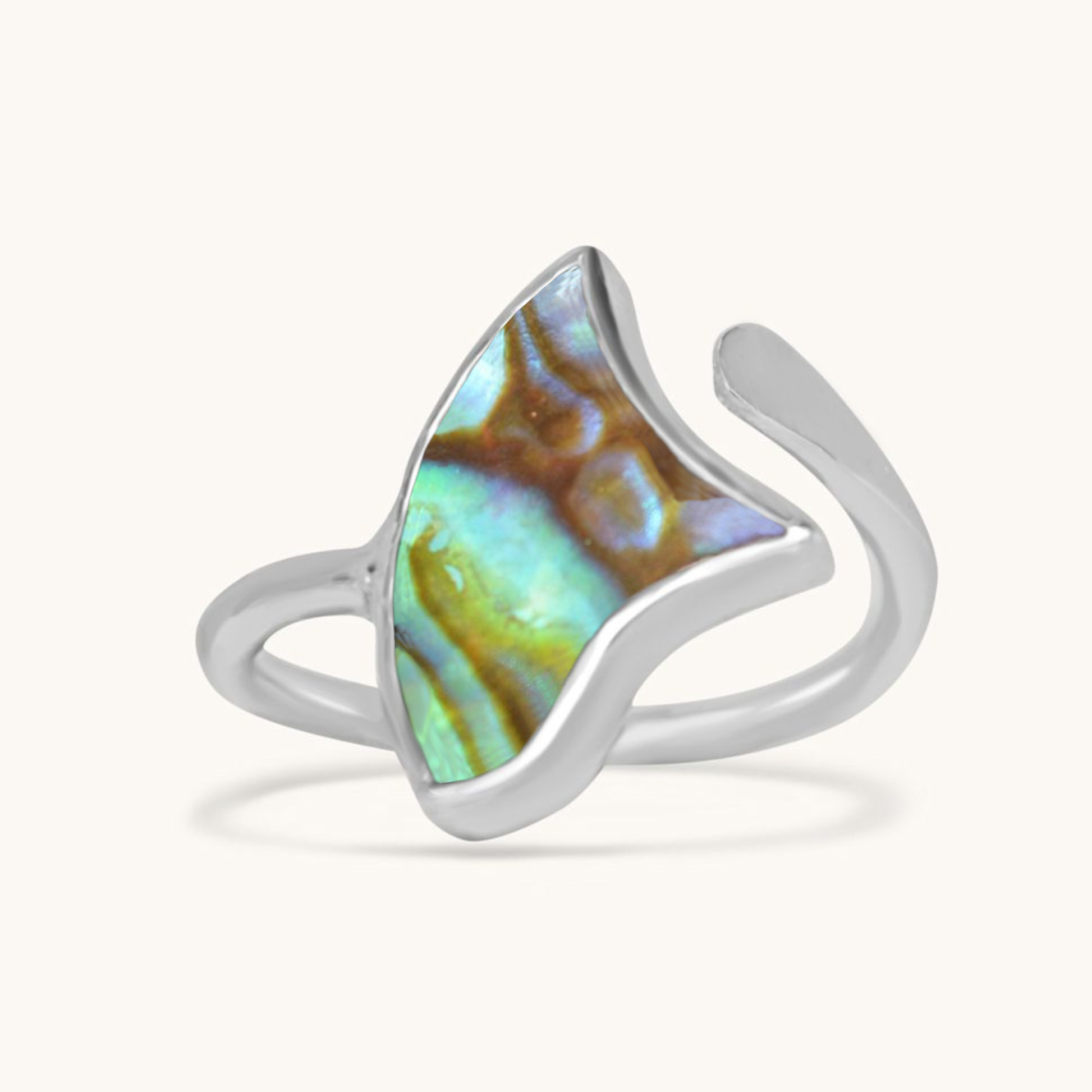 Front-facing shot of a silver-finish ring featuring a triangular, wing-shaped abalone shell with vibrant blue, green, and purple swirls.