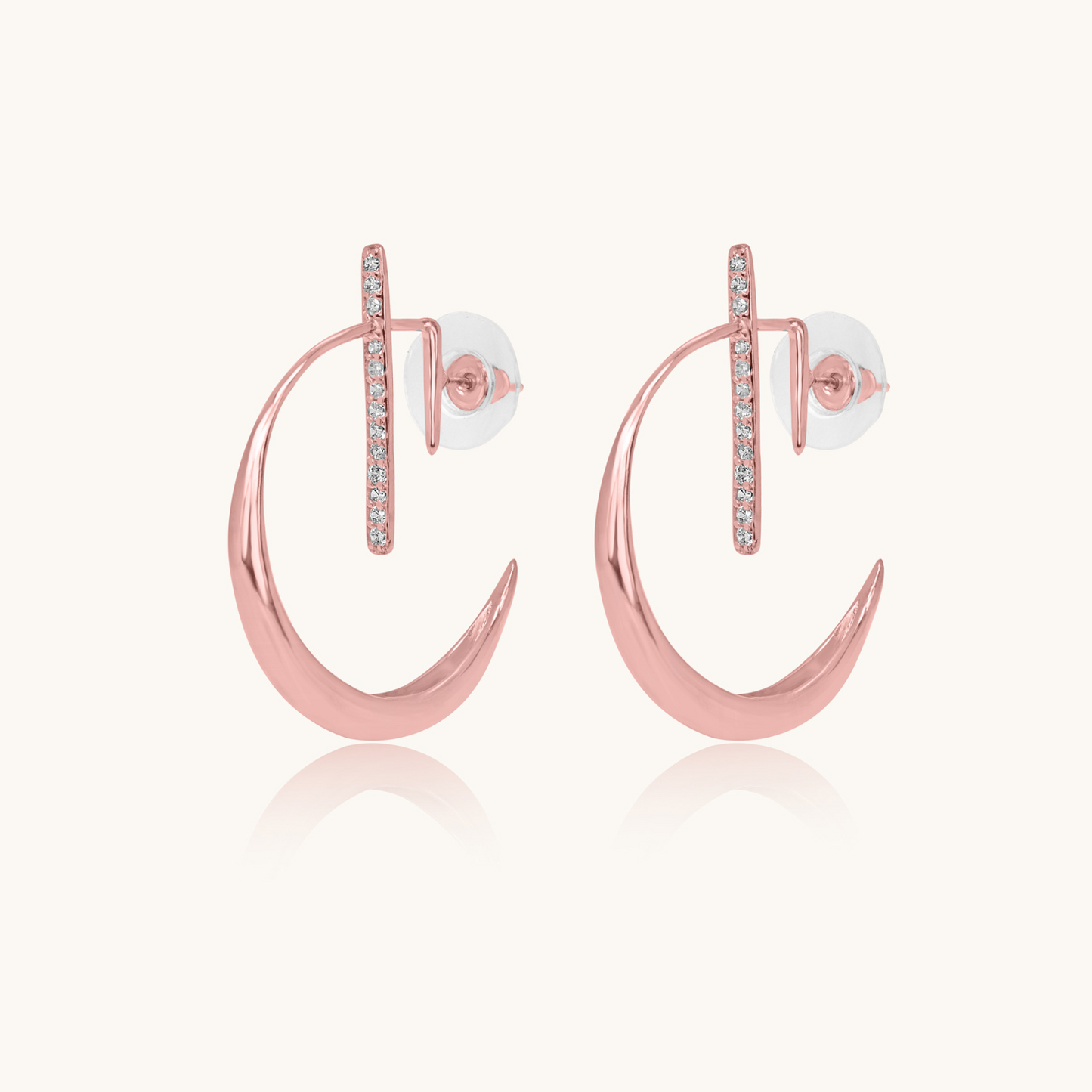 La Luna Rose Gold Earrings featuring a polished crescent moon silhouette and a vertical bar set with sparkling pave diamonds.