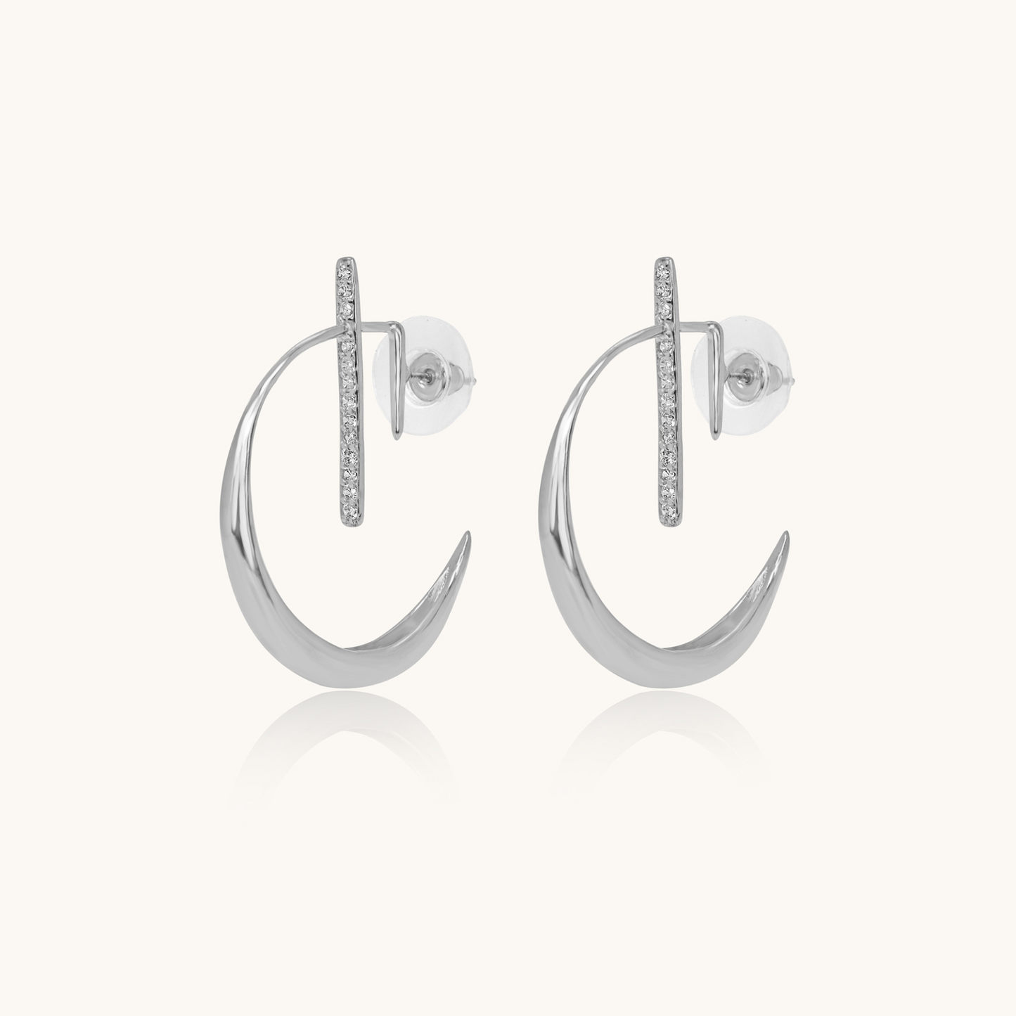 A pair of platinum crescent moon drop earrings with a modern geometric diamond-set bar and secure push-back closures.