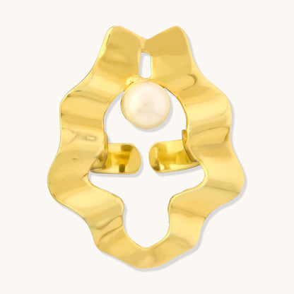 A front-facing studio view of an irregular, wavy gold band with a centered round pearl.