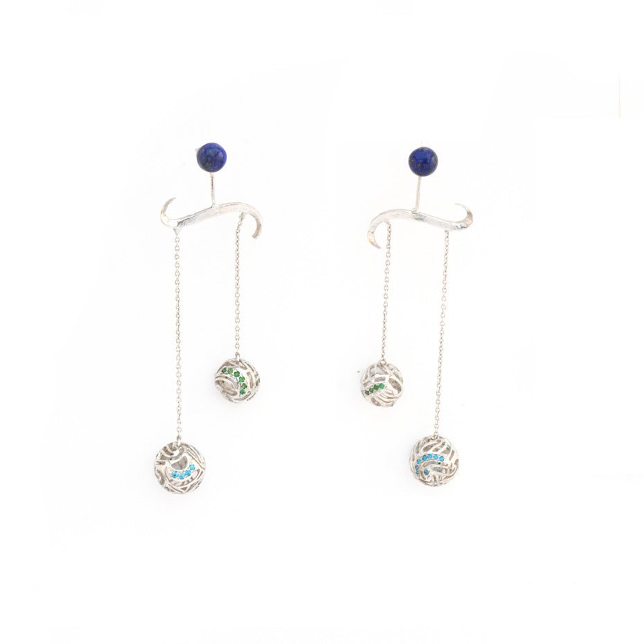 Intricate silver chandelier earrings featuring a tiered wave design with deep blue lapis lazuli gemstones set in a platinum-plated brass filigree.