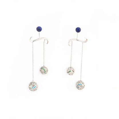 Intricate silver chandelier earrings featuring a tiered wave design with deep blue lapis lazuli gemstones set in a platinum-plated brass filigree.