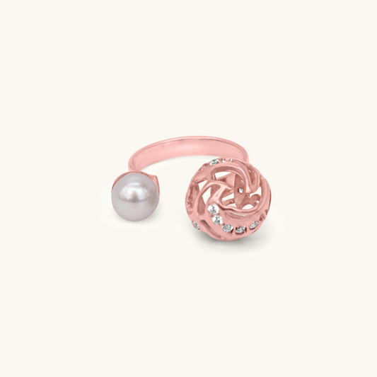Front view of a rose gold-plated ring featuring white pearls stacked vertically in a polished claw setting.