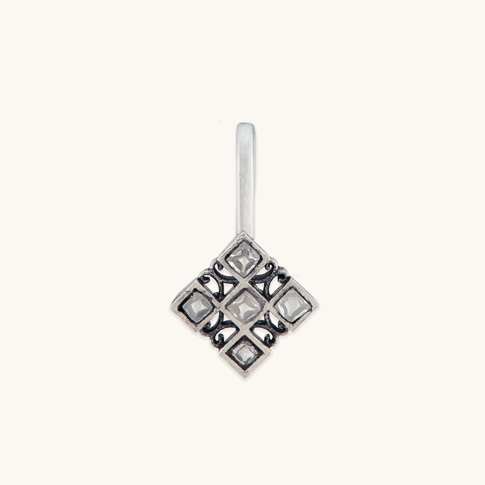 A front-facing studio shot of a silver-toned, square-patterned nose clip featuring a grid of small, clear inset stones.