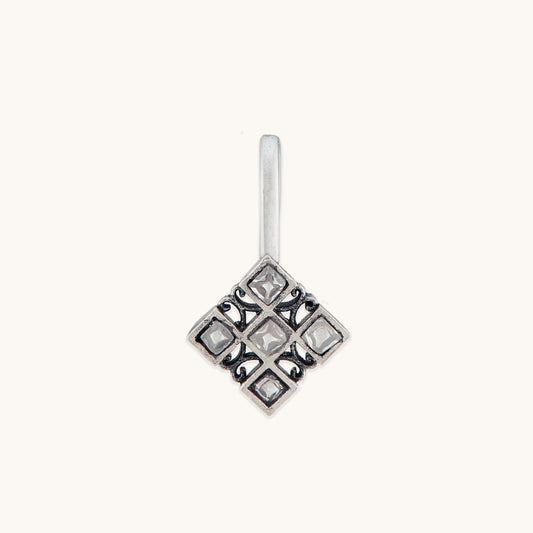 A front-facing studio shot of a silver-toned, square-patterned nose clip featuring a grid of small, clear inset stones.