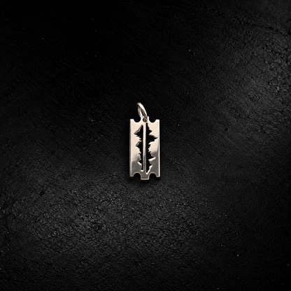 Mountains Are My Lifeline small pendant in 925 silver – razor-blade shape with mountain-peak cut-out, on black slate