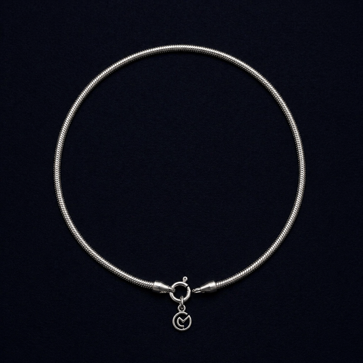 Full circular view of the Bare Shine 925 sterling silver snake chain anklet, featuring a sleek and fluid handcrafted design with a flat polished finish.