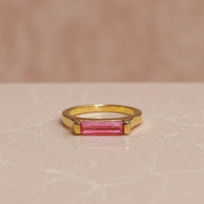 Frontal product shot of the Blush Glow Ring, showcasing the delicate blush tone of the rectangle-cut pink jade and the clean, minimal design.