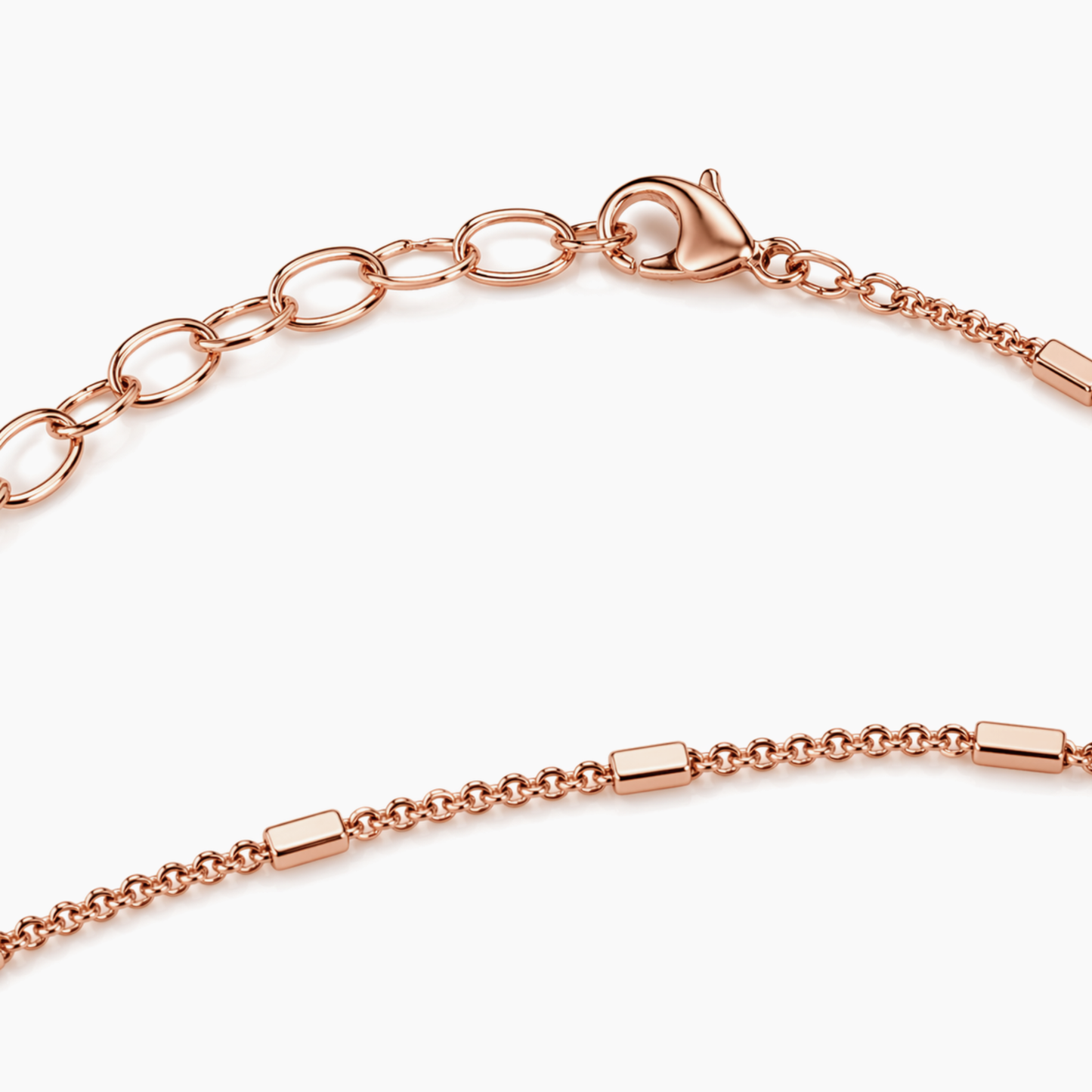 A close-up view of the Blush Sleek Elegance necklace, highlighting the modern rectangular bar links, the delicate chain, and the polished rose gold finish on the lobster clasp and extender.