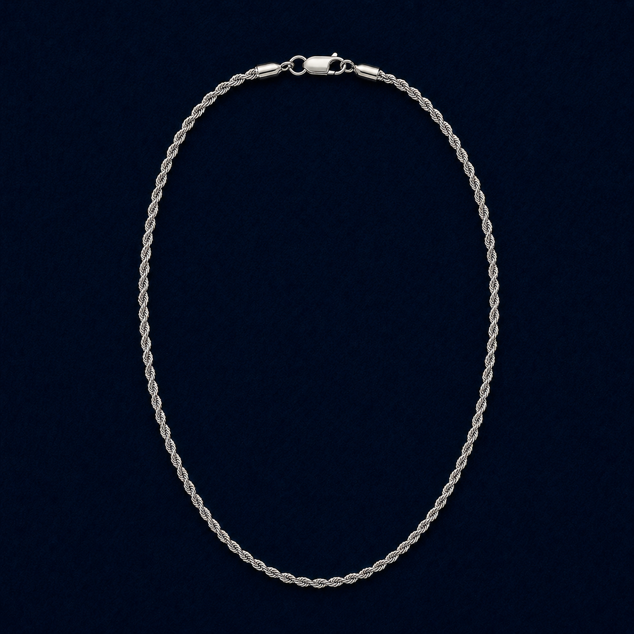 A full studio shot of the handcrafted Easy Everyday Elegance necklace in 925 sterling silver, featuring a classic twisted rope chain design on a dark navy background.