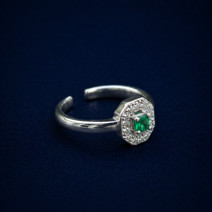 An angled profile of the handcrafted Evergreen Spark Ring in 925 sterling silver, showcasing the open adjustable band and the elegant raised gemstone setting.