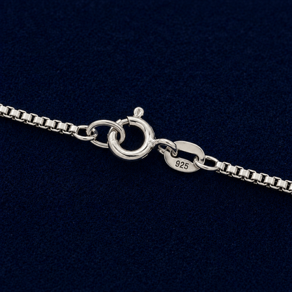 Detailed close-up of a handcrafted 925 sterling silver box chain necklace showing the secure lobster clasp and 925 authenticity hallmark against a navy background.