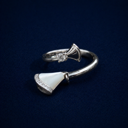 Side profile of the Twilight Curve Ring on a dark navy background, highlighting the iridescent shimmer of the fan-shaped inlay and the polished silver wrap-around design.