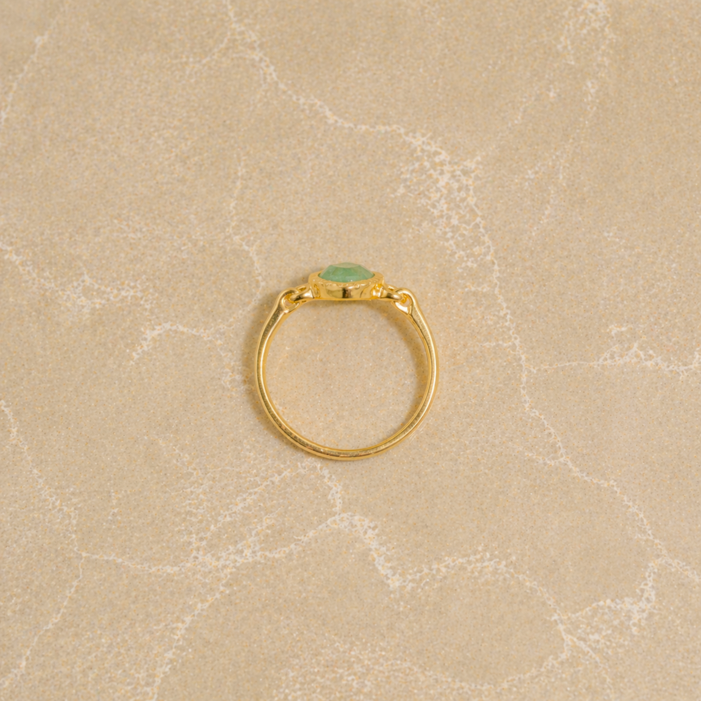 Calm Aura Ring showcasing the slim 925 sterling silver band and the vibrant green tones of the square diamond-shaped stone.