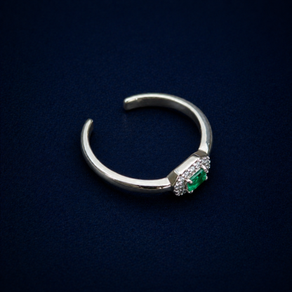 Perspective shot of the Evergreen Spark Ring highlighting the vibrant green cubic zirconia center stone and the modern octagonal halo of clear CZ stones.