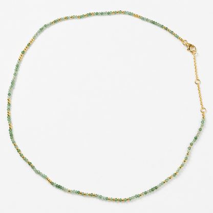 Full studio shot of the Nature’s Calm necklace on a white background, displaying the delicate mixed-stone beaded strand and the adjustable 18kt gold plated lobster clasp.