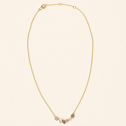 Full studio shot of the Soft Harmony necklace on a white background, displaying the elegant stone cluster design and the adjustable 18kt gold plated lobster clasp.