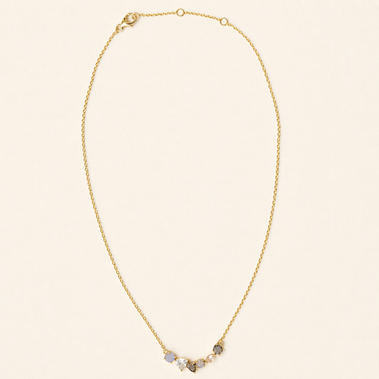 Full studio shot of the Soft Harmony necklace on a white background, displaying the elegant stone cluster design and the adjustable 18kt gold plated lobster clasp.
